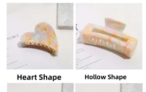 Close-up of heart and rectangular acetate hair claws with macaron marble texture patterns