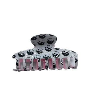 Classic Tai Chi Yin Yang hair claw clip with black white pattern and pink interior