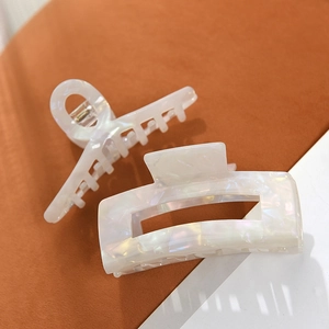 Large pearl white marble acetate hair claws in arched and rectangular hollow styles