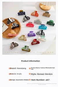 Close-up of assorted acrylic hollow hair claws with rhinestones and marble patterns