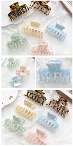 Close-up of five different acetate claw clips showing classic structure and spring details