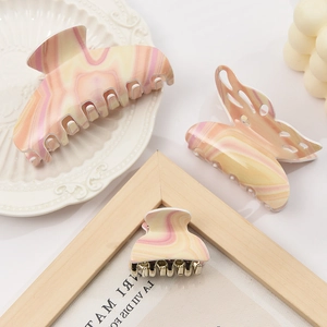 Three-piece butterfly hair claw set with candy-colored marble texture acetate finish