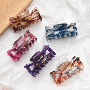 Five assorted marble texture bow claw clips in colorful acrylic for women's hairstyling