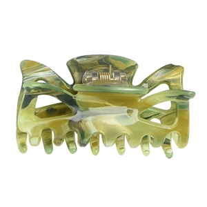 Medium acrylic bow hair claw with elegant green marble pattern and metal spring