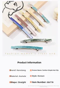 Detail view of acetate barrette hair clips with marble patterns and glitter finishes