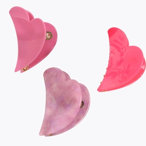 Three-piece heart-shaped acetate hair claw clips in pink, rose red, and marble purple colors