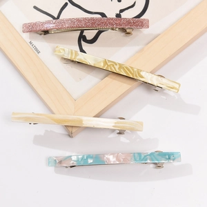 Colorful acetate barrette clips set in pink, yellow and blue marble textures for women