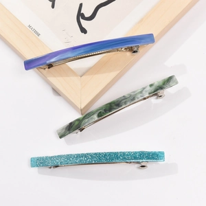 Three-piece acetate rectangle hair clip set in purple marble, green and teal glitter