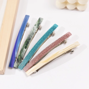 5-piece set of acetate hair clips in gradient blue, marble green, and glitter finishes