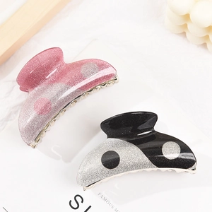 Yin Yang style acrylic hair claw clips with pink and black glitter polka dot design