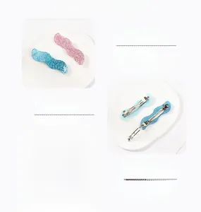 Detailed macro view of acrylic wavy hair pins with metal clips in various pastel colors
