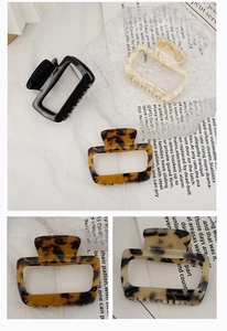Close-up of square hollow acetate hair claws in marble and tortoiseshell patterns
