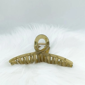 13cm large matte amber claw clip with metal spring on white faux fur background