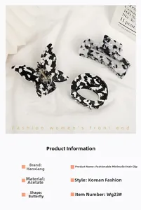 Detailed view of acetic acid hair clips in butterfly and geometric black and white patterns