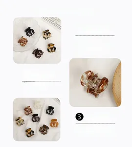 Detailed view of polished acetate hair claw clips in various colors and classic spring mechanism