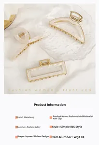 Close-up of three acetate hair claws in marble white with gold alloy frames in various shapes