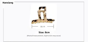 Detail view of 8cm amber tortoiseshell acetate hair claw with square hollow design