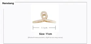 Detailed view showing the 11cm large acetate shark hair clip with marble pattern