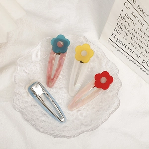 Floral acetate hair clips in candy colors for women featuring marble texture and metal base