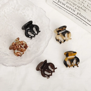 5-piece set of mini acetate hair claws in black and tortoise shell patterns on a white background
