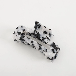 Elegant black and white tortoiseshell acetate hair claw clip with butterfly design