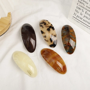Five-piece set of oval acetate hair clips in tortoiseshell and marble patterns