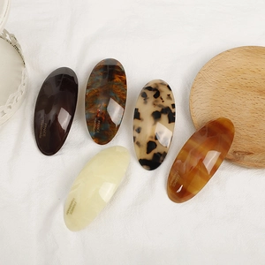 Set of five elegant acetate oval hair clips with classic tortoiseshell and marble patterns