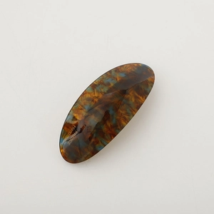 Elegant oval tortoiseshell hair clip in brown and blue marble finish acetate fiber