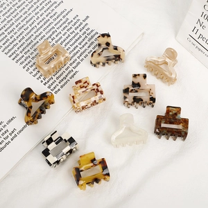 Mini acetate hair claws in checkered, leopard, and marble patterns for elegant styling