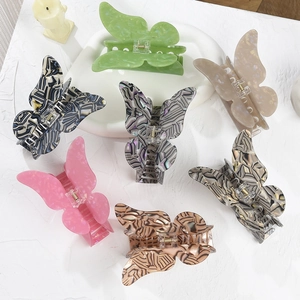 Set of large butterfly hair claws in various marble and amber acrylic patterns