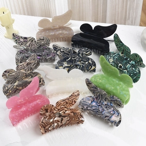 Large butterfly hair claws in acetate variety including pink, green and leopard print