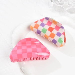 2-piece checkerboard acrylic hair claw set in pink and multicolor floral pattern