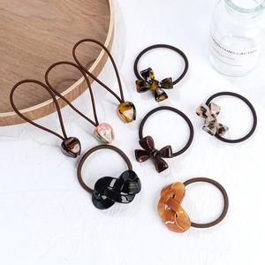 French style hair tie collection with resin bow and tulip accents for elegant hairstyles