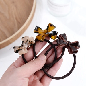 Set of three French style acetate bow hair ties with leopard and tortoise patterns
