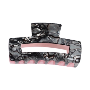 Pince à cheveux rectangulaire en acétate marbré rose et noir au design évidé élégant