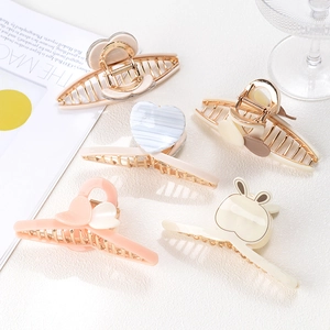 Elegant large gold metal hair claw clips with heart and rabbit patterns set
