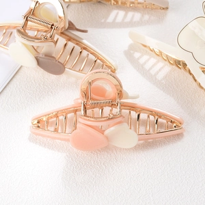 Elegant acetate heart hair claw clips in pastel colors with metal base for women