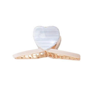 Minimalist heart hair claw clip with blue and white stripes on a pale pink base