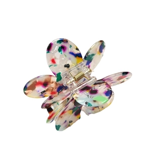Floral acrylic hair claw clip with colorful ink splatter texture and gold spring