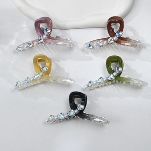 Acrylic hair claw clips set with crystal hearts and pearls in five vibrant colors