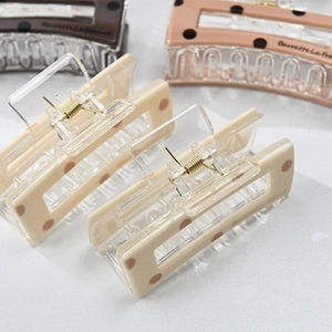 Polka dot acetate square hair claws in beige and brown colors with golden spring