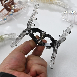 Close-up showing the metal spring and internal structure of this large hair claw clip