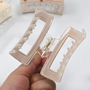 Fashionable geometric square hair claw clip in light brown acetate with gold spring