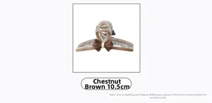 Détail d'une pince à cheveux de 10,5 cm marron châtaigne avec nœud et ressort doré