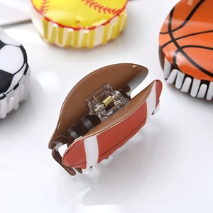 Set of sports themed acrylic hair claws featuring basketball, soccer and rugby designs