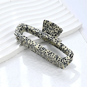 Minimalist square acetate hair claw clip with black and white dalmatian dot pattern