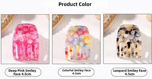 Detailed view of 4.5cm smiley face hair claws in pink, gradient and leopard patterns