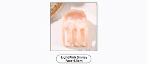 Detail of light pink smiley face hair claw clip with 4.5cm acetate finish for women