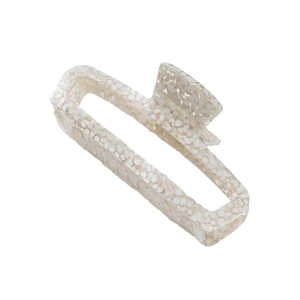 Minimalist square hollow hair claw in beige acetate with elegant stone texture