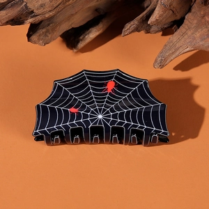Halloween spider web hair claw clip in black and red resin for festive hair styling